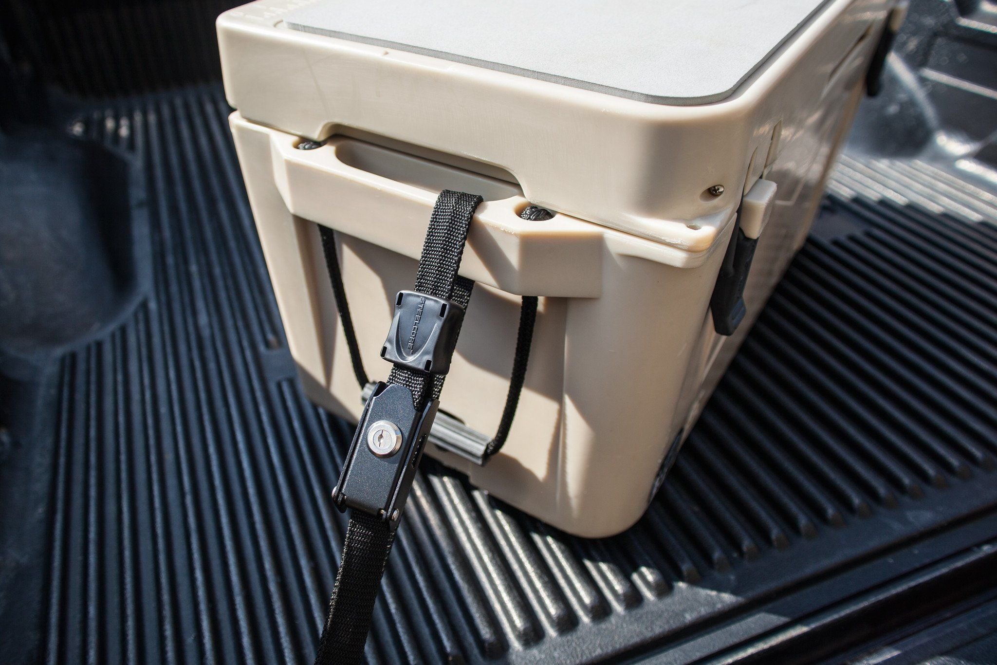 Steelcore Security Strap for high-end coolers. Marine quality buckles and a hardened aluminum cam protect it from the elements making it ideal for expedition and marine use. Key-locking, theft-resistant. Coolers Accessories. Best Marine Coolers Made in USA 